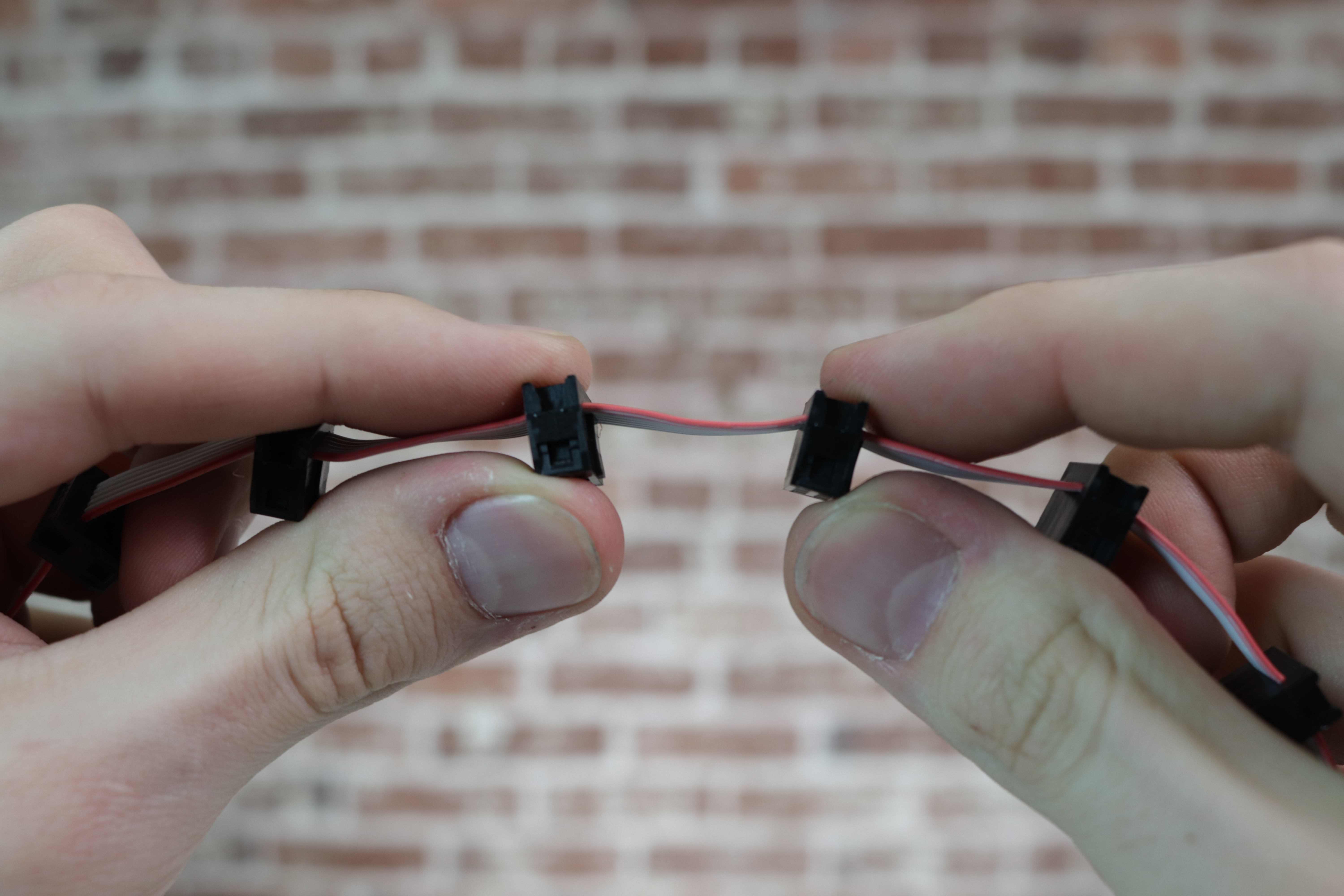 Holding the cable between two connectors